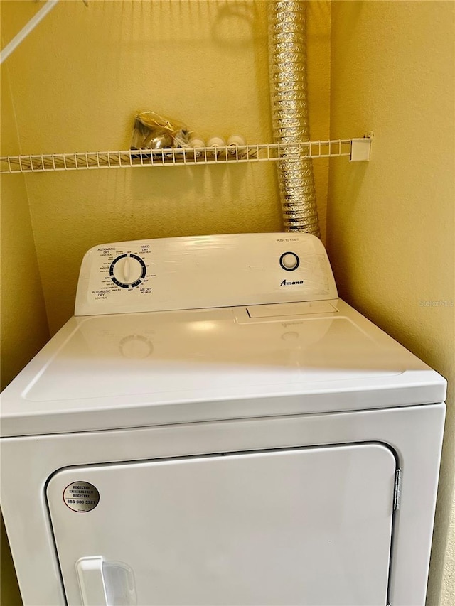 laundry room featuring washer / dryer