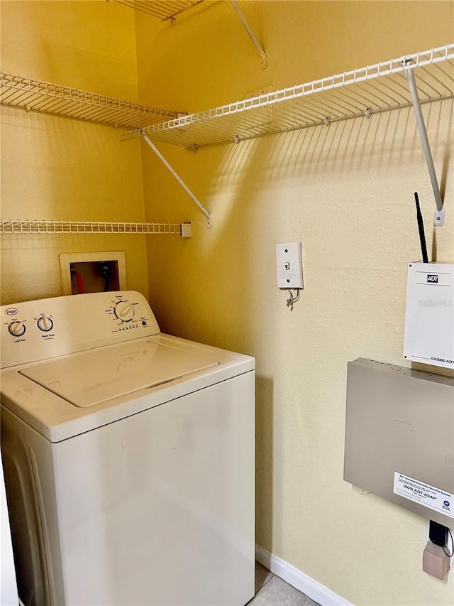 washroom with washer / dryer