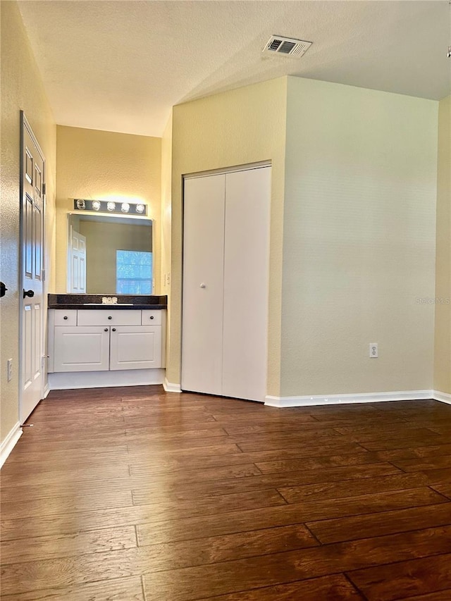 interior space featuring hardwood / wood-style flooring and a closet