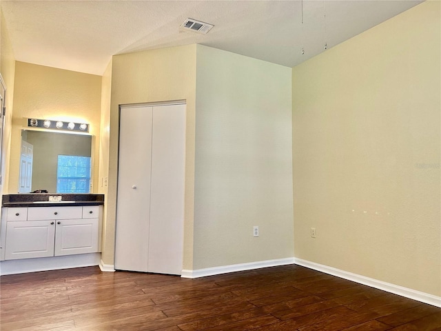 interior space featuring dark hardwood / wood-style flooring and sink