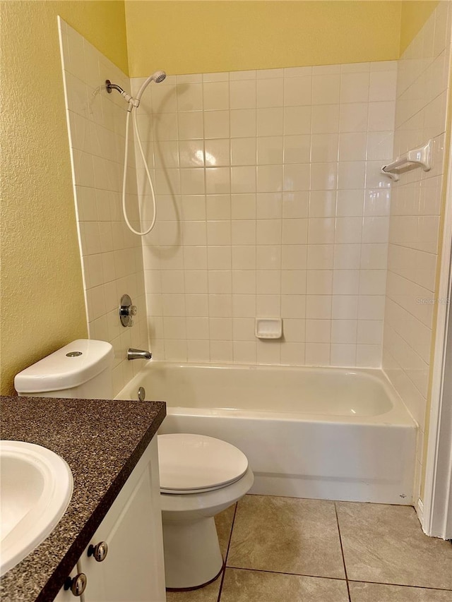 full bathroom featuring tile patterned floors, vanity, toilet, and shower / washtub combination