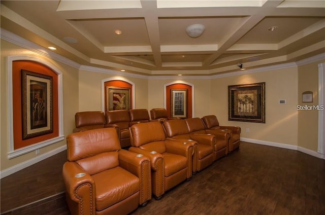 cinema with dark hardwood / wood-style floors, ornamental molding, and coffered ceiling