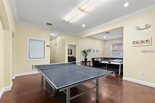 game room featuring dark hardwood / wood-style floors and ornamental molding