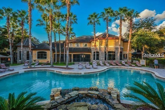 view of swimming pool featuring a patio area