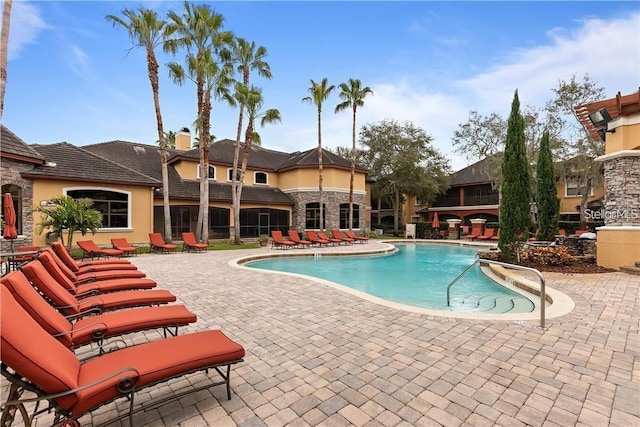 view of swimming pool featuring a patio area