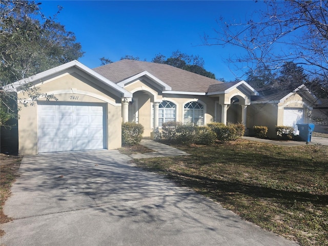 single story home featuring a garage