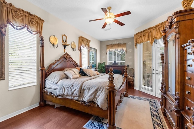 bedroom featuring access to exterior, ceiling fan, french doors, and dark wood-type flooring