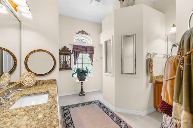 bathroom with tile patterned floors and vanity