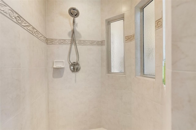 bathroom with a tile shower