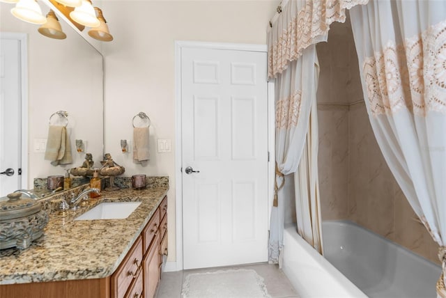 bathroom featuring tile patterned floors, vanity, and shower / tub combo