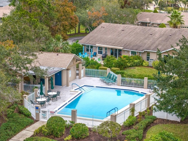 view of swimming pool with a patio