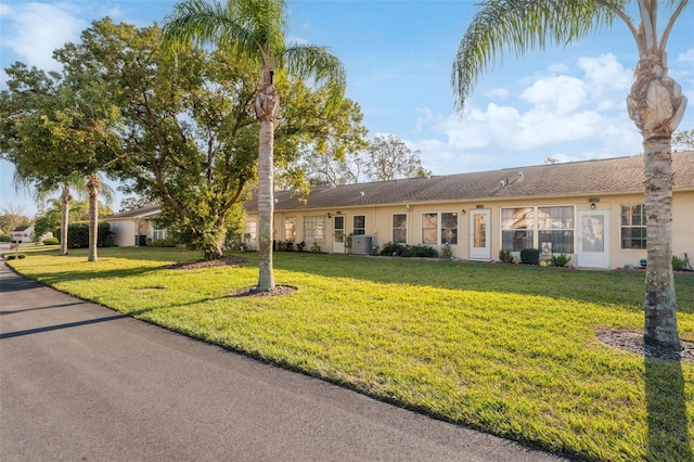 ranch-style home with a front yard