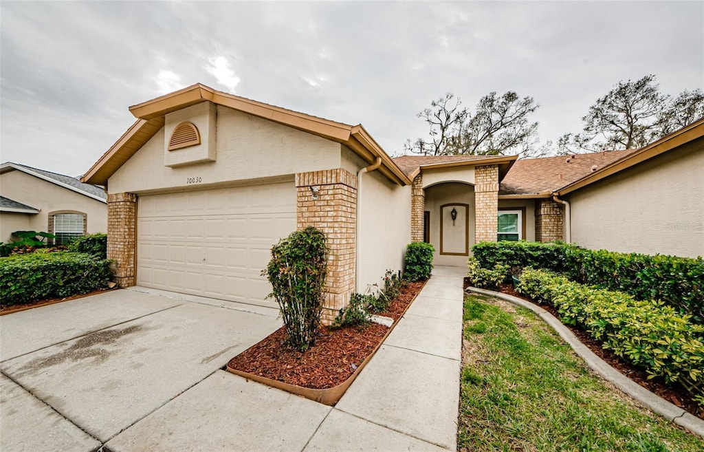 ranch-style house featuring a garage