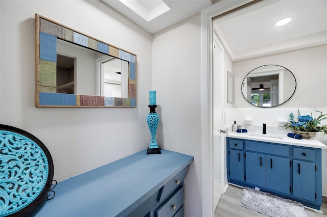 bathroom featuring vanity and hardwood / wood-style flooring