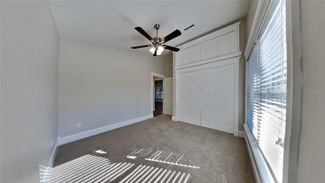 unfurnished bedroom with light colored carpet, a closet, and ceiling fan