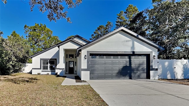 ranch-style house with a front yard and a garage