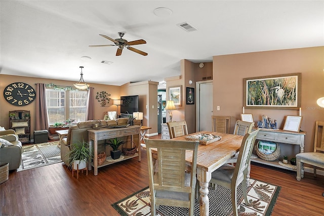 dining space with dark hardwood / wood-style floors and ceiling fan