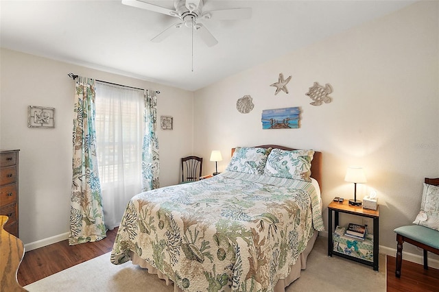 bedroom with wood-type flooring and ceiling fan