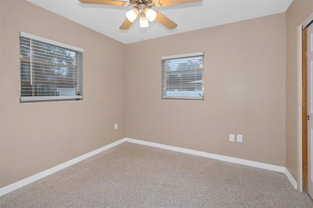 unfurnished room with carpet flooring and ceiling fan