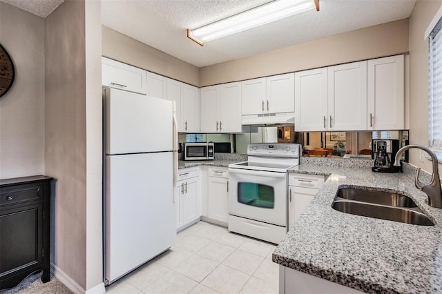 kitchen with sink, kitchen peninsula, a textured ceiling, white appliances, and white cabinets