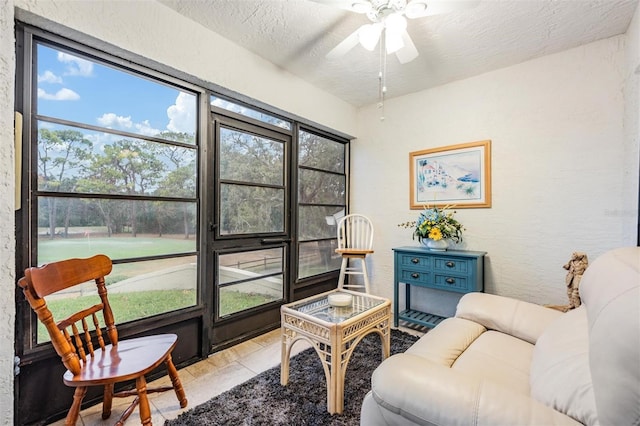 sunroom / solarium with ceiling fan