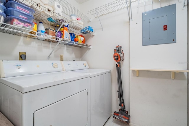 washroom with electric panel and washing machine and clothes dryer