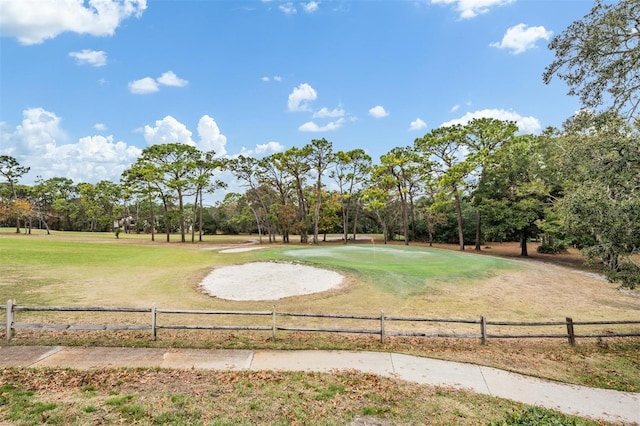 view of property's community with a lawn