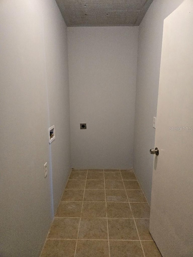 clothes washing area featuring hookup for an electric dryer and washer hookup