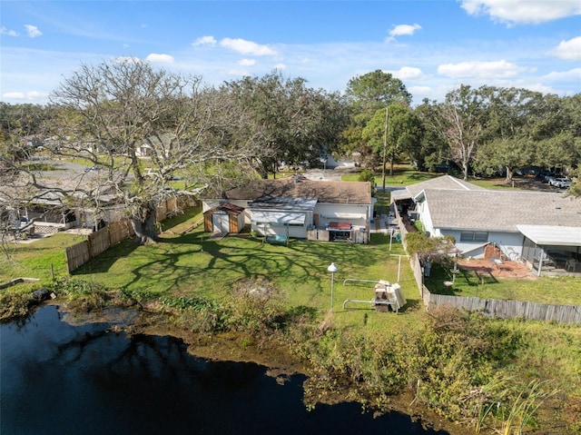 birds eye view of property with a water view