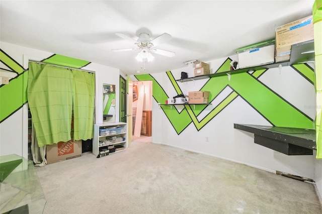 recreation room with carpet flooring and ceiling fan