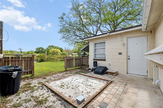 view of patio featuring fence