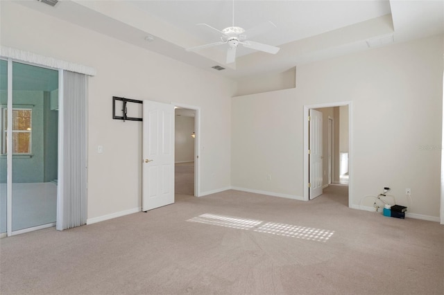 unfurnished bedroom with ceiling fan and light carpet