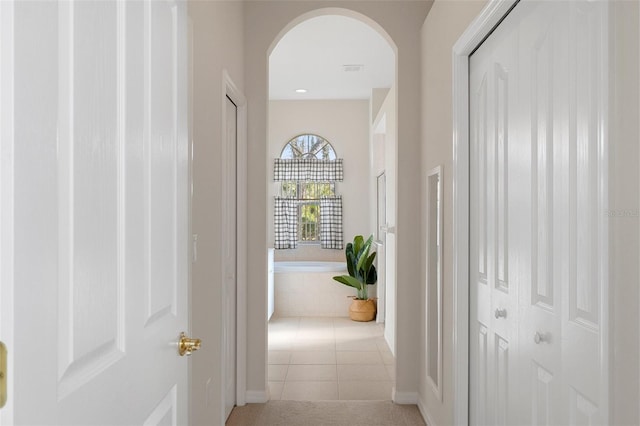 hallway with light tile patterned floors