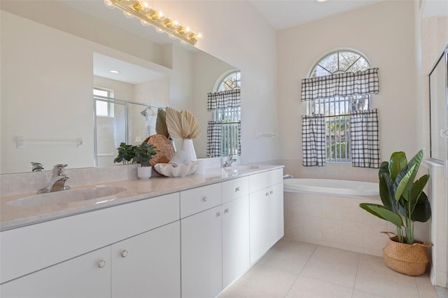 bathroom with vanity, tile patterned floors, and independent shower and bath