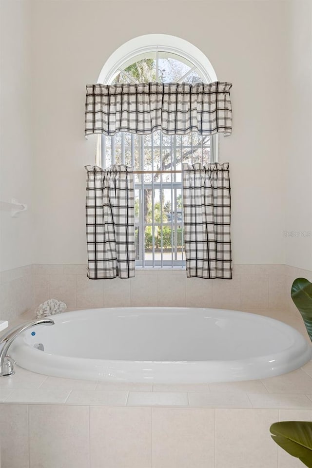 bathroom with tiled bath