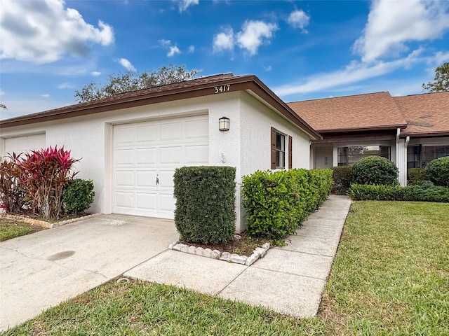 view of home's exterior featuring a lawn and a garage