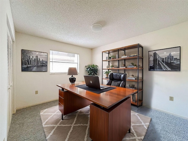 home office featuring a textured ceiling