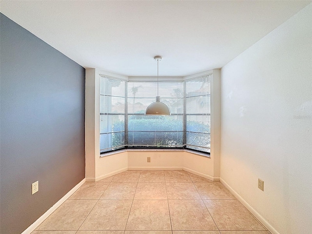 unfurnished dining area featuring light tile patterned flooring