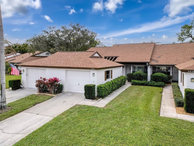 single story home with a front lawn and a garage