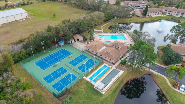 birds eye view of property with a water view