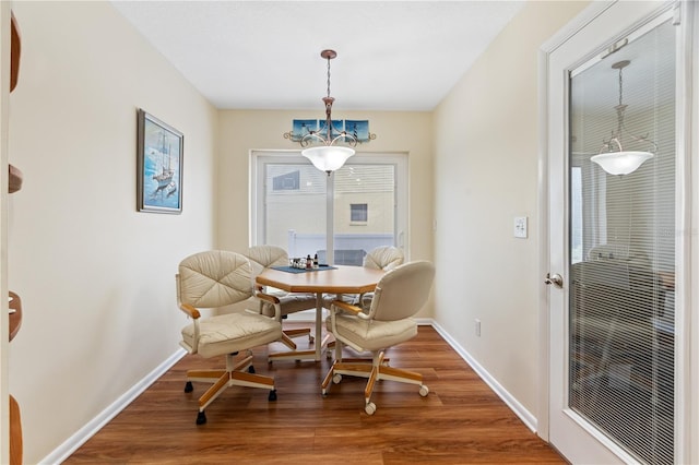 dining area with wood-type flooring