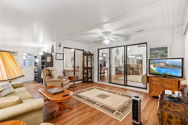 living room with ceiling fan and light hardwood / wood-style floors