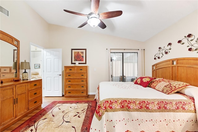 bedroom with ceiling fan, light hardwood / wood-style floors, and lofted ceiling