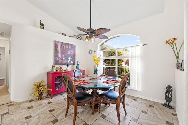 dining area featuring lofted ceiling and ceiling fan