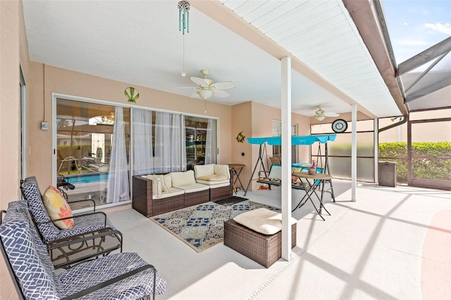 sunroom with ceiling fan