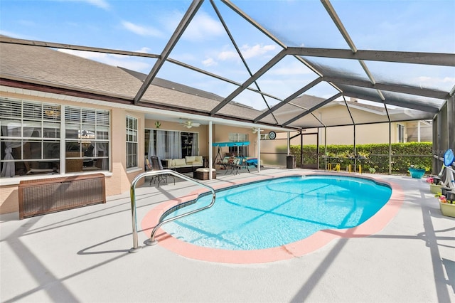 view of swimming pool with ceiling fan, a lanai, a patio, and an outdoor hangout area