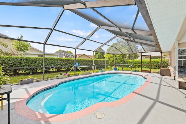 view of pool featuring a lanai and a patio area