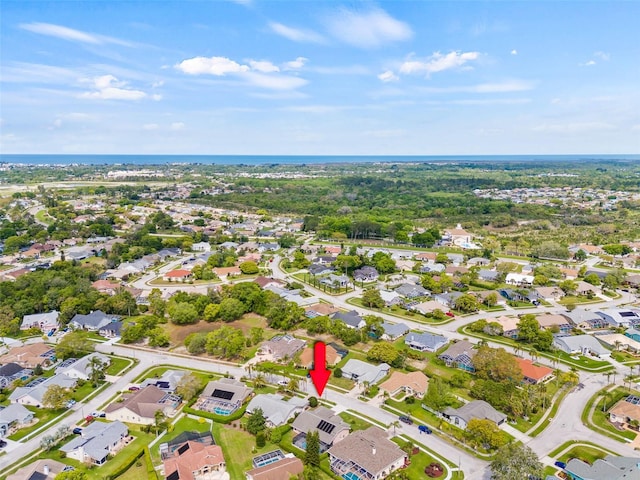 drone / aerial view featuring a water view