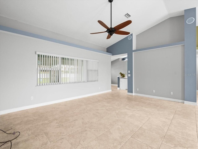 interior space with vaulted ceiling, light tile patterned floors, and ceiling fan