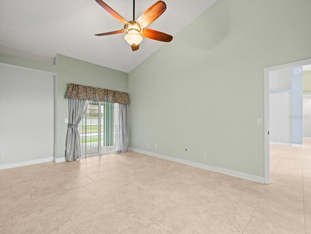 empty room featuring ceiling fan and high vaulted ceiling